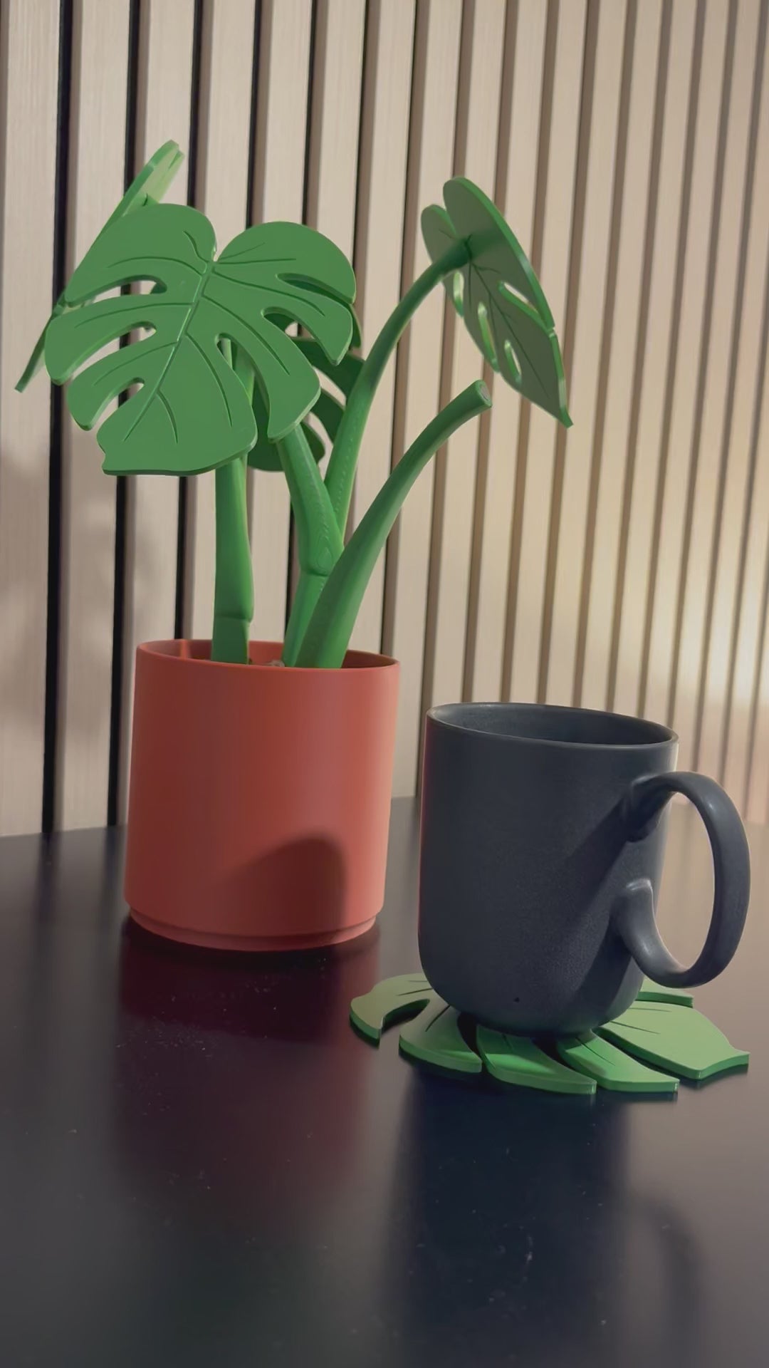 Putting the coaster back onto the plant using magnets